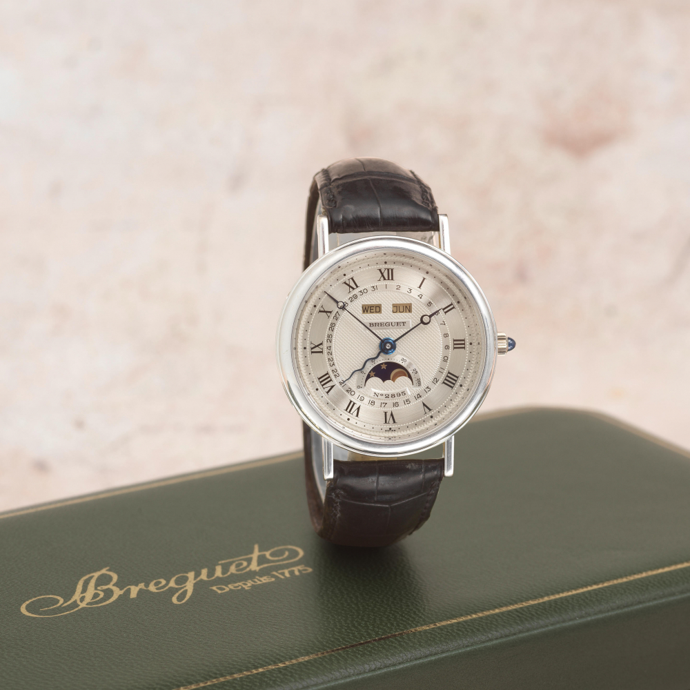 Breguet. A fine 18K white gold automatic triple calendar wristwatch with moon phase