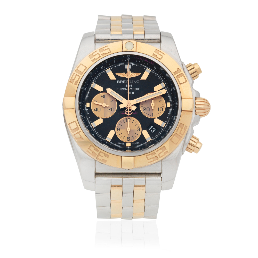 Breitling. A stainless steel and gold automatic calendar chronograph bracelet watch