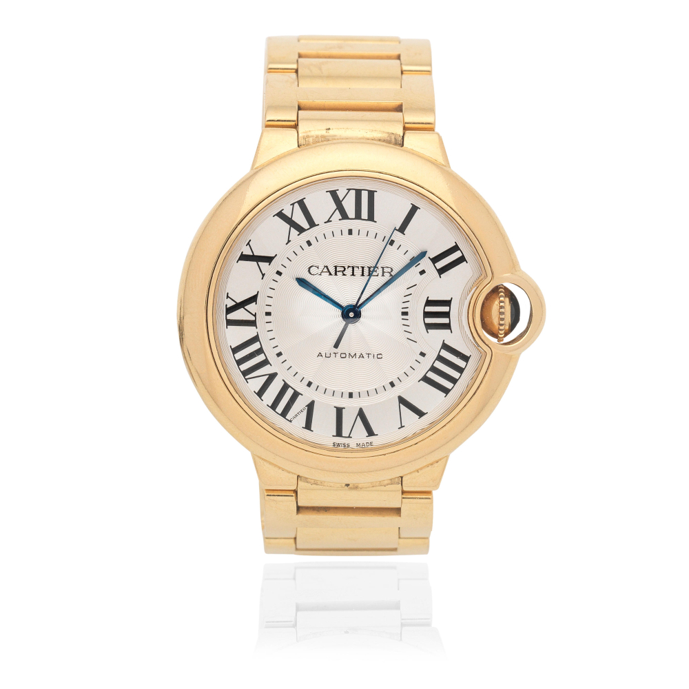 Cartier. An 18K gold automatic calendar bracelet watch