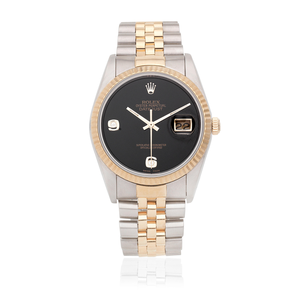 Rolex. A stainless steel and gold automatic calendar bracelet watch with diamond set onyx dial
