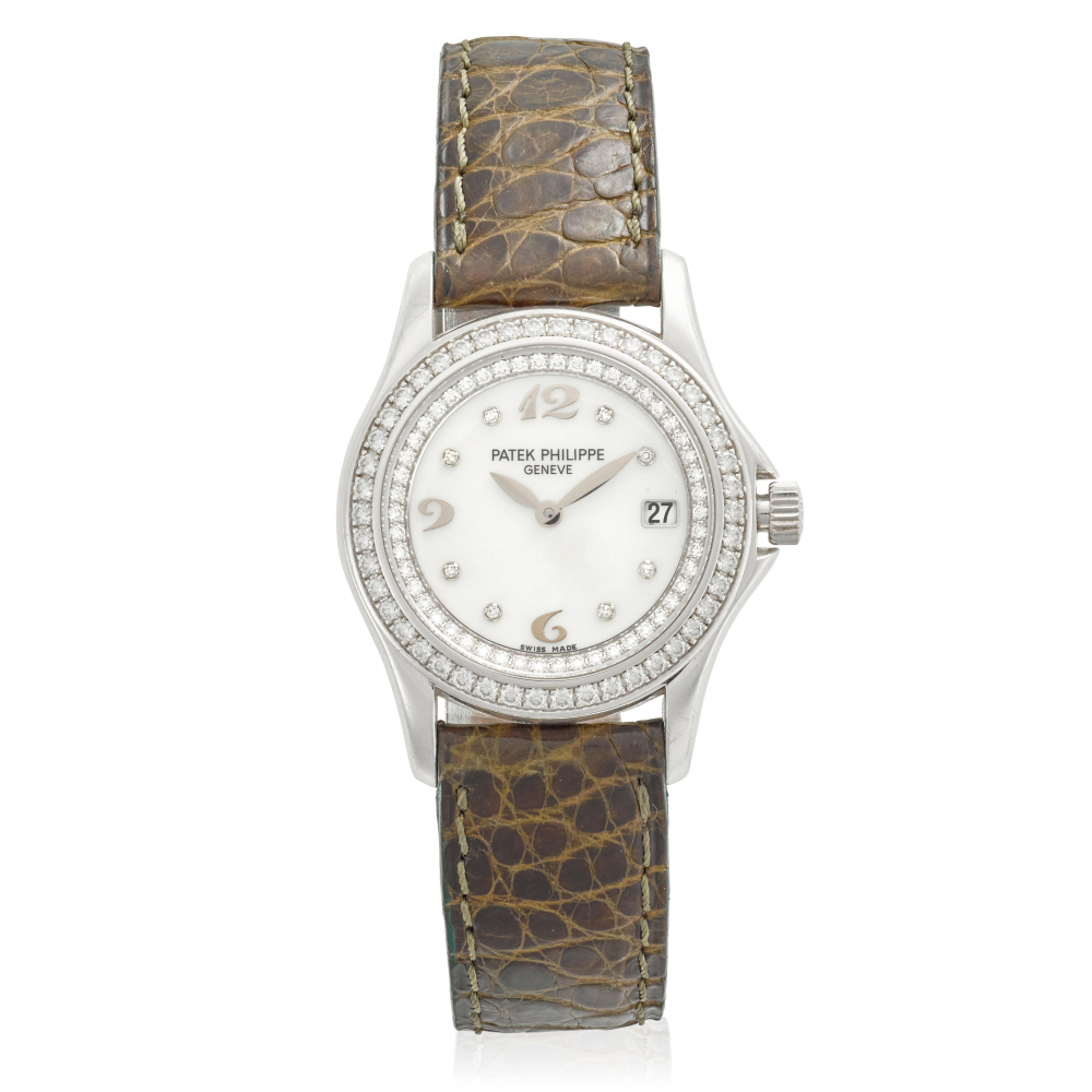 PATEK PHILIPPE. A FINE LADY'S 18K WHITE GOLD AND DIAMOND SET QUARTZ CALENDAR WRISTWATCH