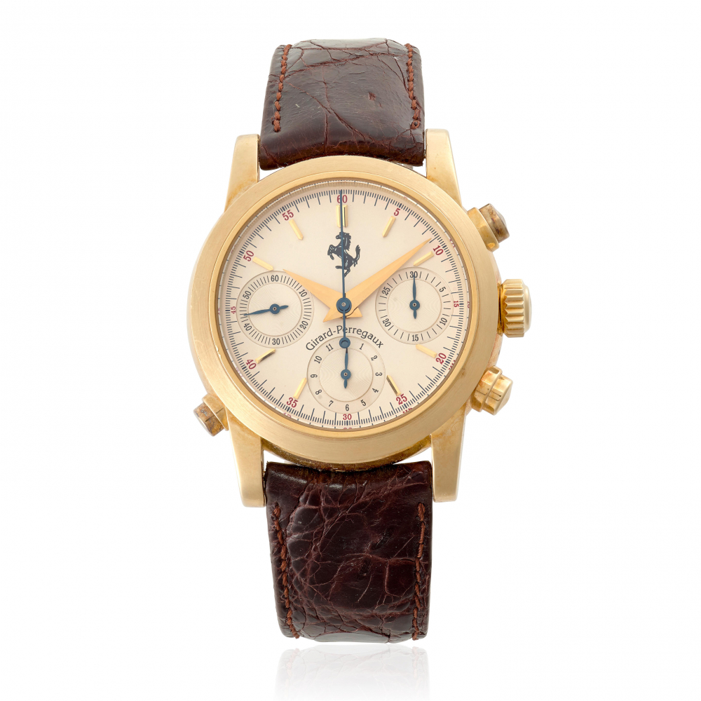 GIRARD-PERREGAUX FOR FERRARI. AN 18K GOLD AUTOMATIC SPLIT SECOND CHRONOGRAPH WRISTWATCH