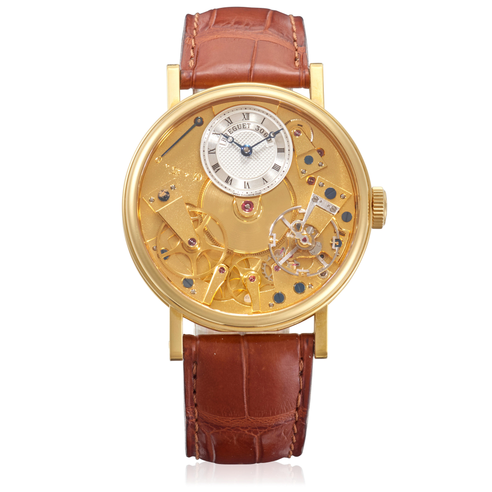 BREGUET. AN 18K GOLD MANUAL WIND SKELETONIZED WRISTWATCH WITH POWER RESERVE INDICATION