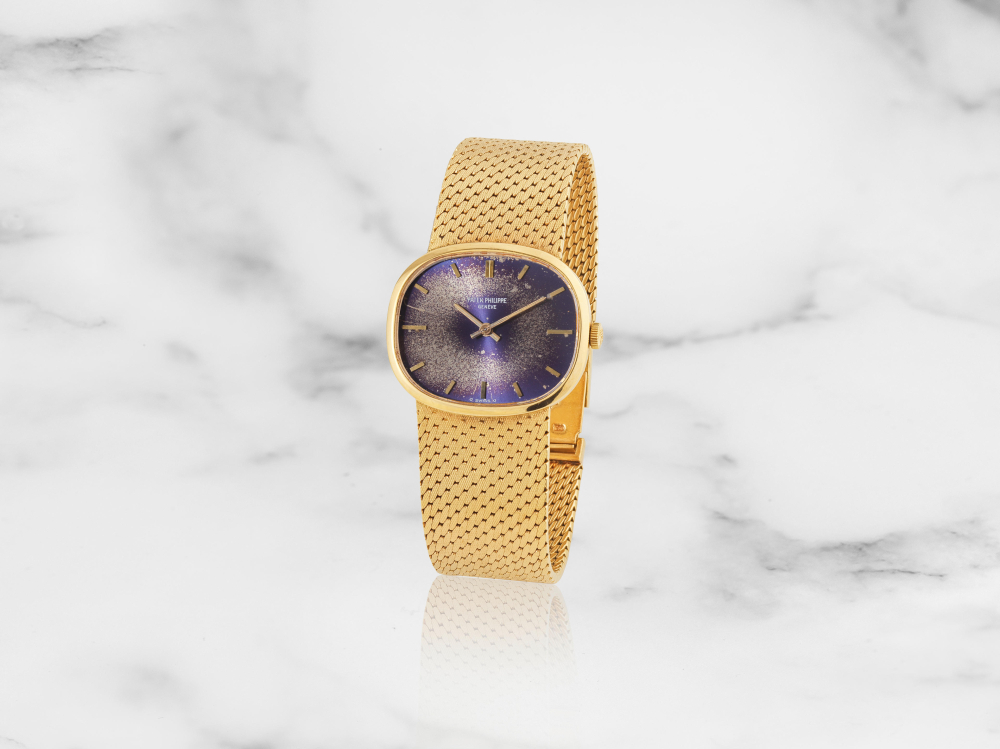 Patek Philippe. Montre bracelet en or jaune 18K (750) avec cadran sigma mouvement mécanique