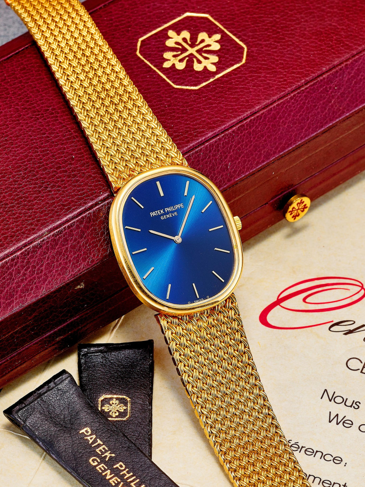 PATEK PHILIPPE | ELLIPSE, REF.3778, A YELLOW GOLD WRISTWATCH WITH DISTRIBUTOR'S YELLOW GOLD BRACELET, CIRCA 1987
