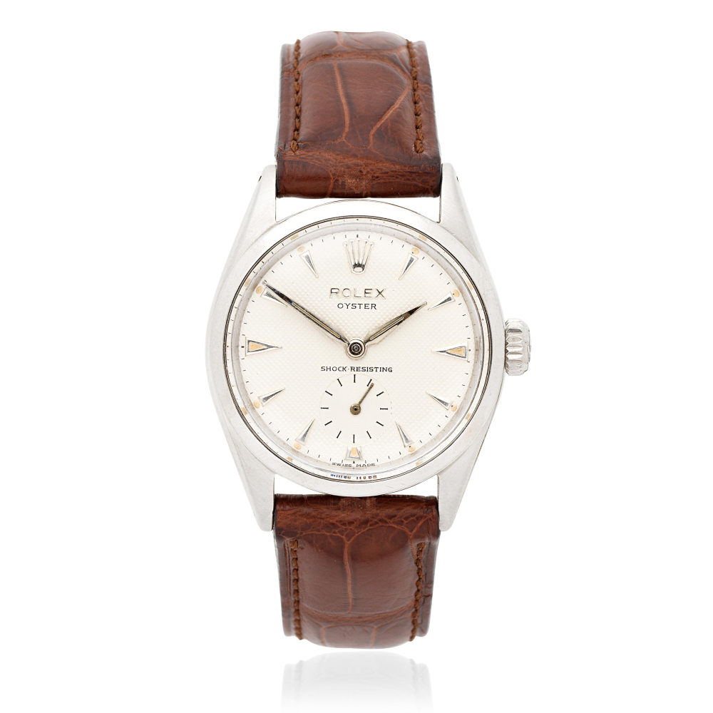 Rolex. A stainless steel manual wind wristwatch