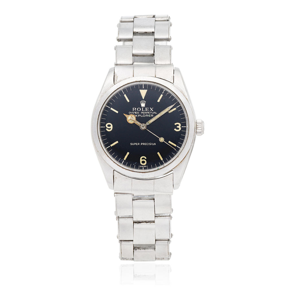 Rolex. A stainless steel automatic bracelet watch with gilt gloss dial
