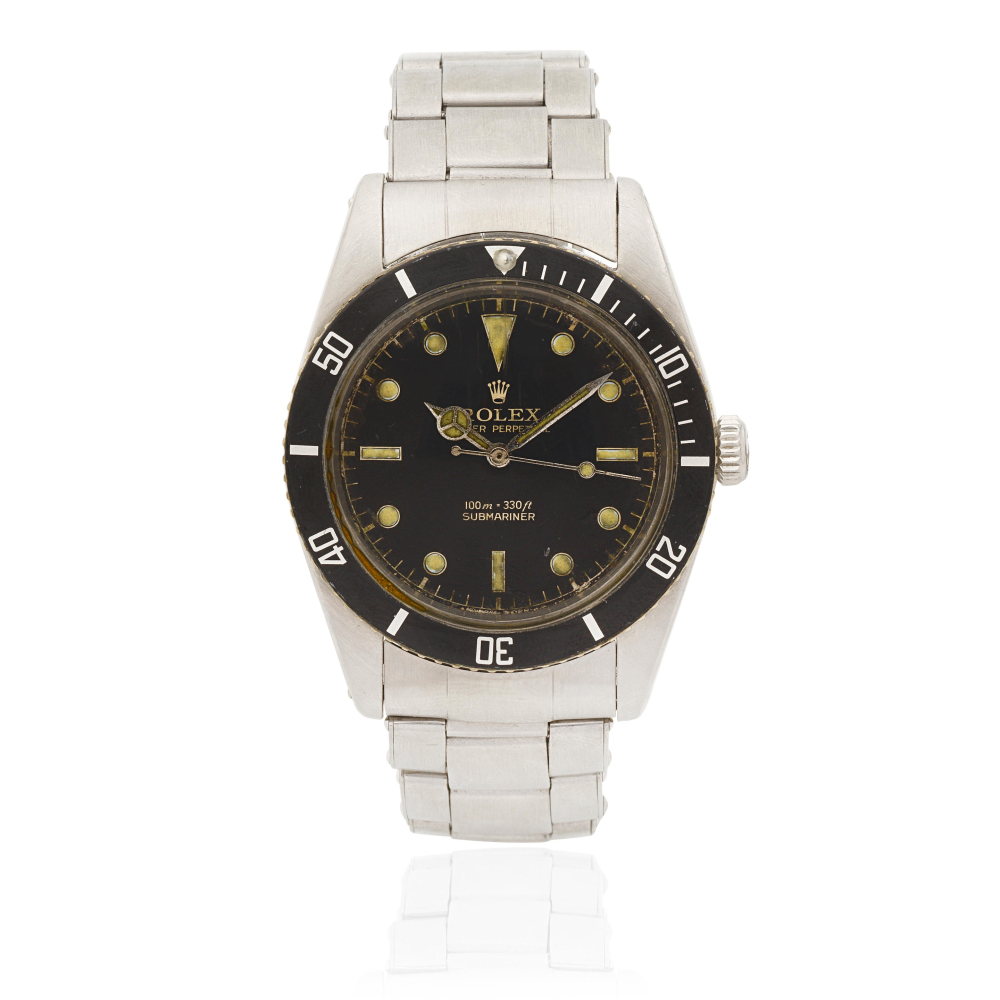Rolex. A stainless steel automatic bracelet watch with gilt gloss dial