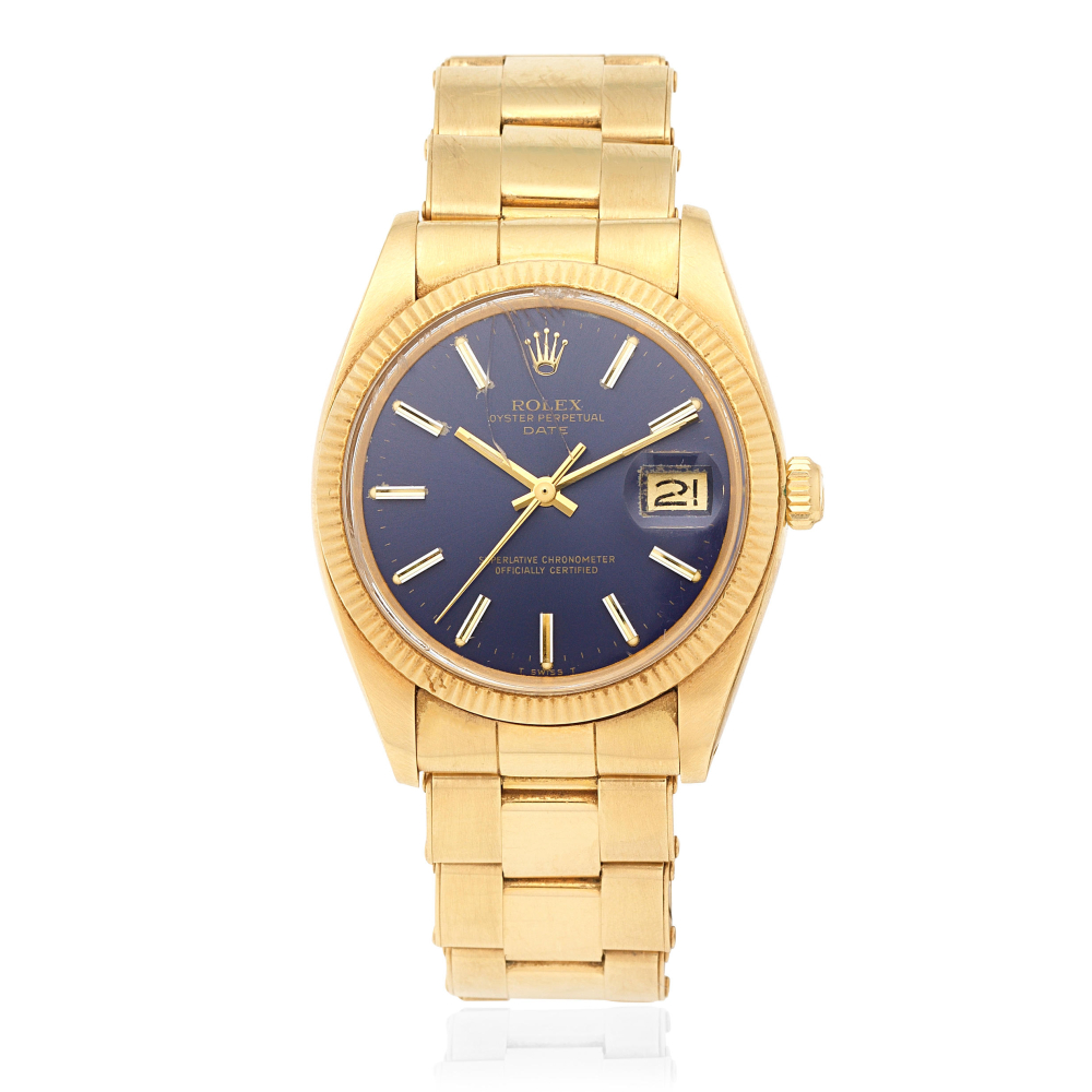 Rolex. An 18K gold automatic calendar bracelet watch