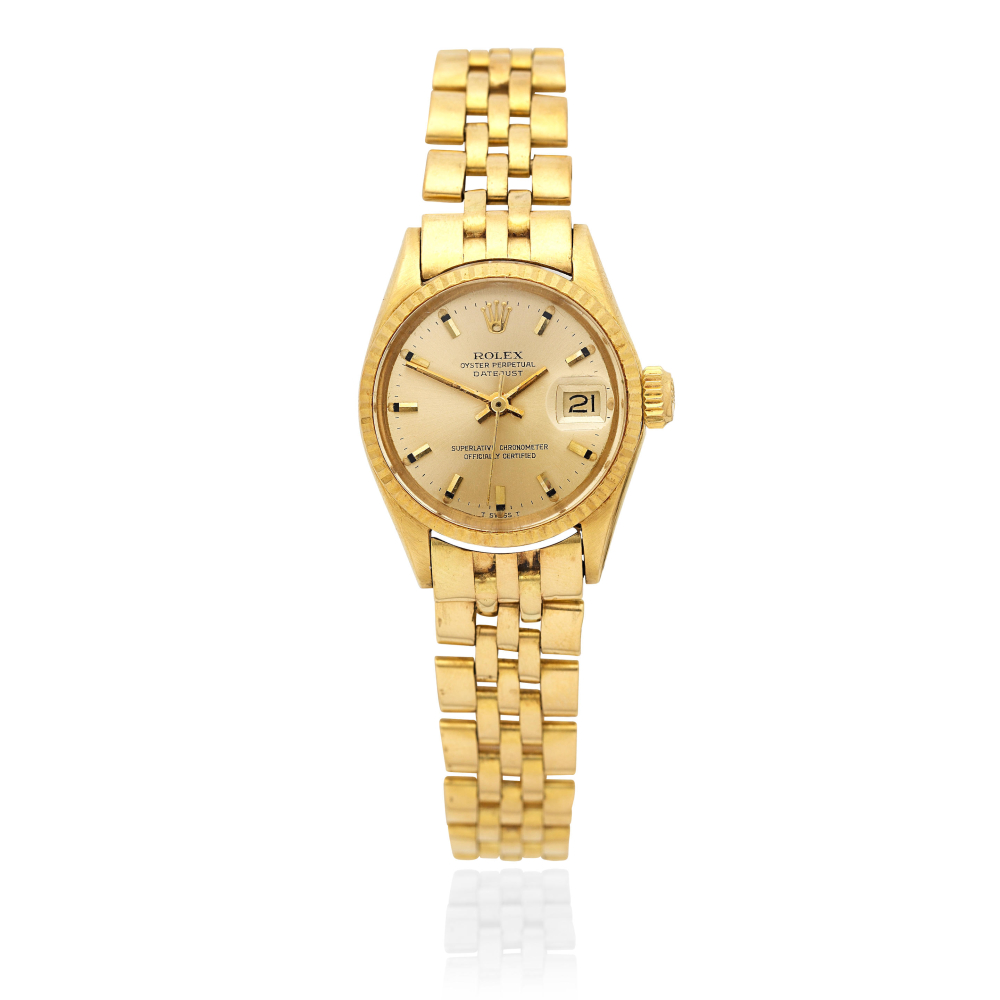 Rolex. A lady's 18K gold automatic calendar bracelet watch