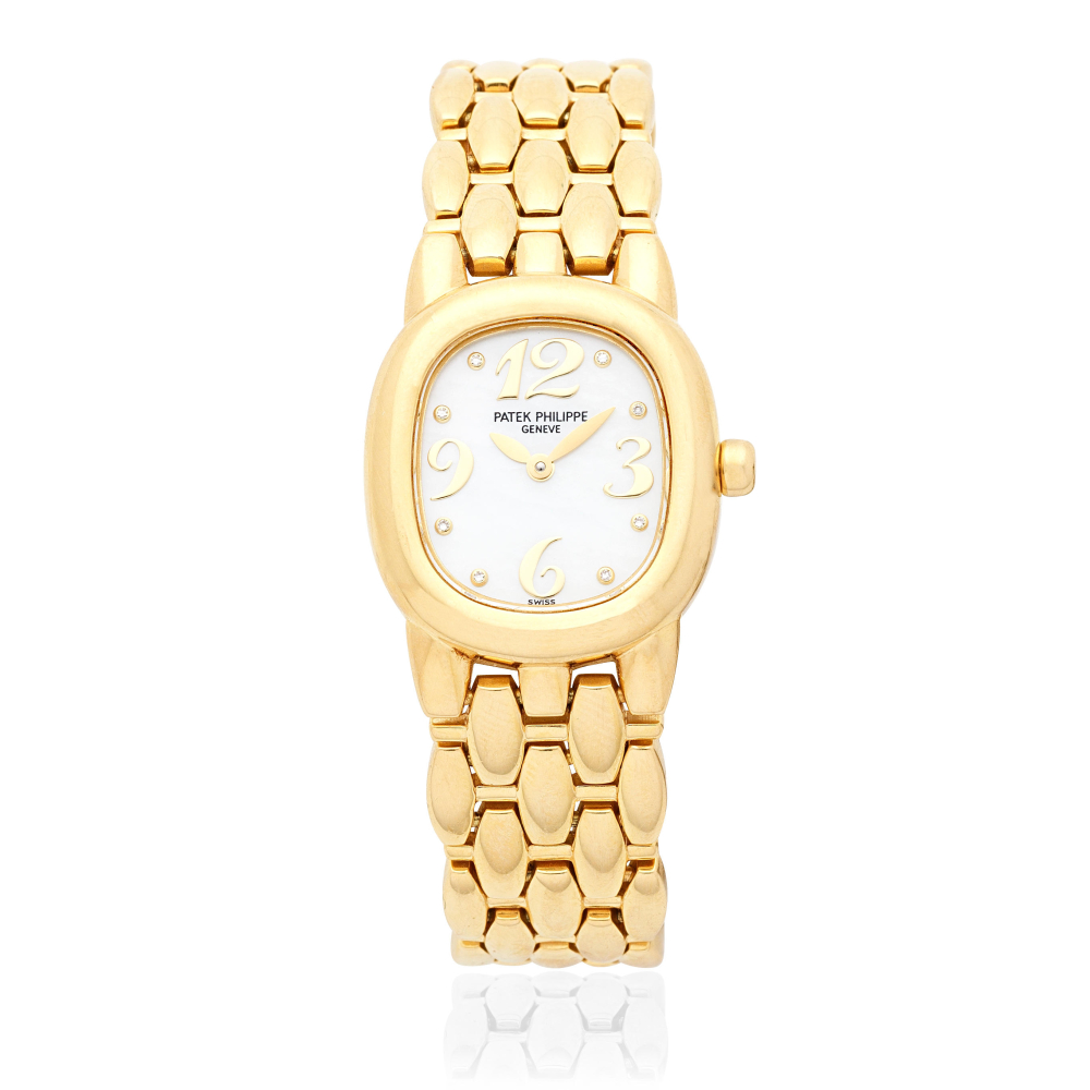 Patek Philippe. A lady's 18K gold diamond set quartz bracelet watch with mother of pearl dial