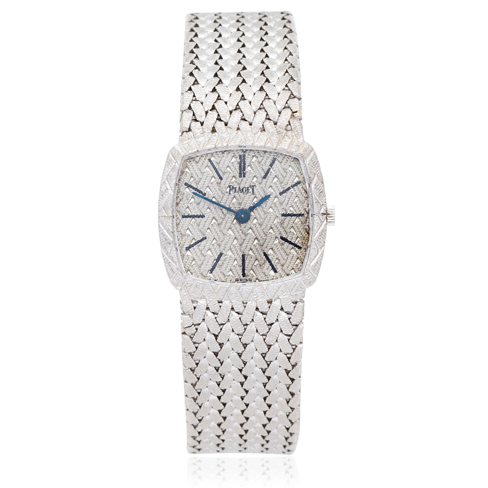 Piaget. A lady's 18K white gold manual wind bracelet watch