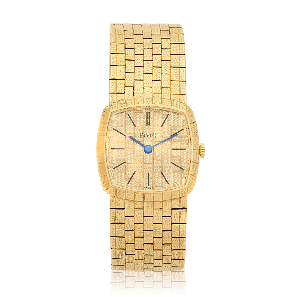 Piaget. A lady's 18K gold manual wind bracelet watch
