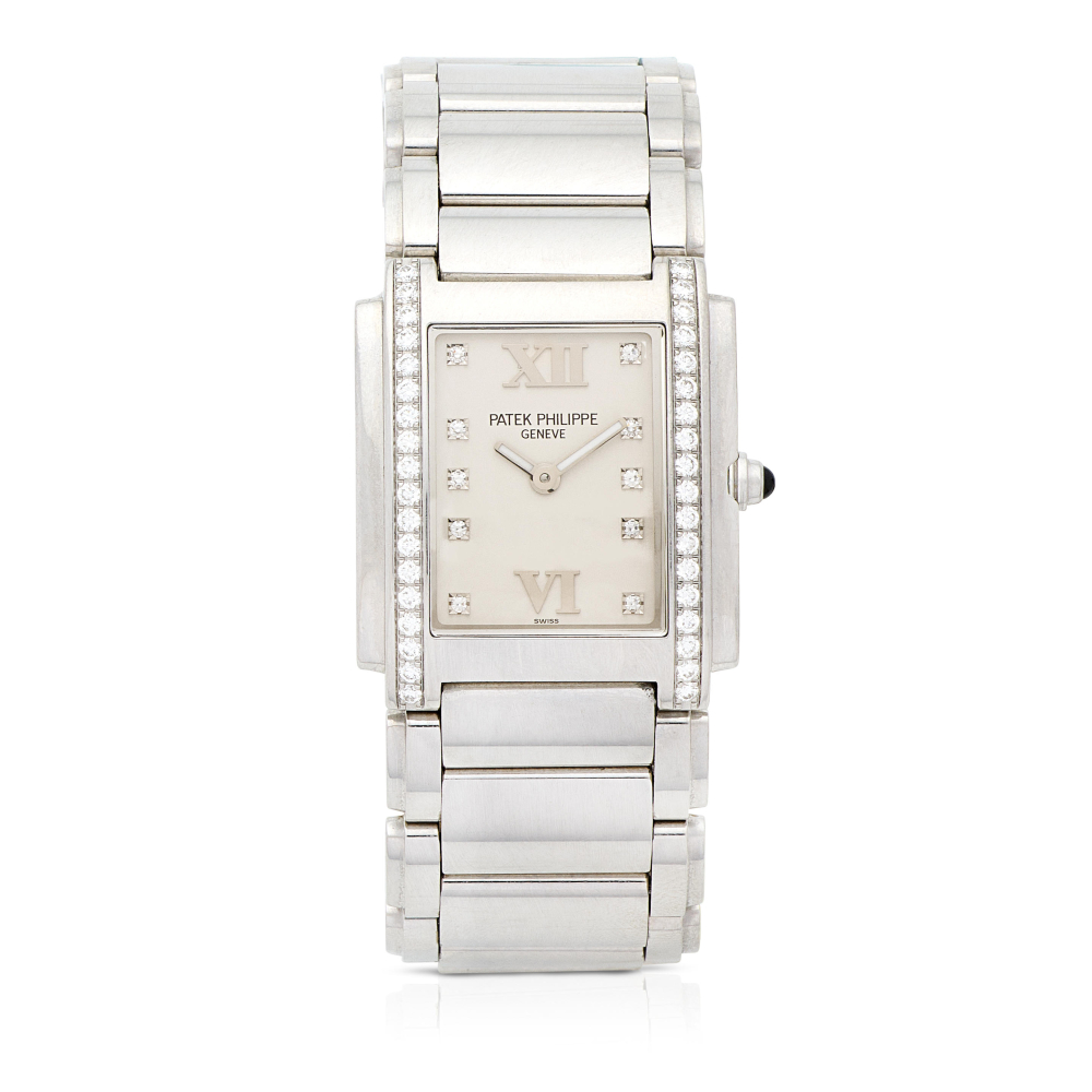 Patek Philippe. A lady's stainless steel diamond set quartz bracelet watch