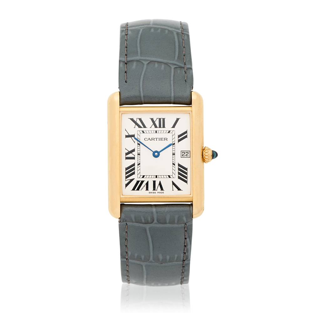 Cartier. An 18K gold quartz calendar wristwatch