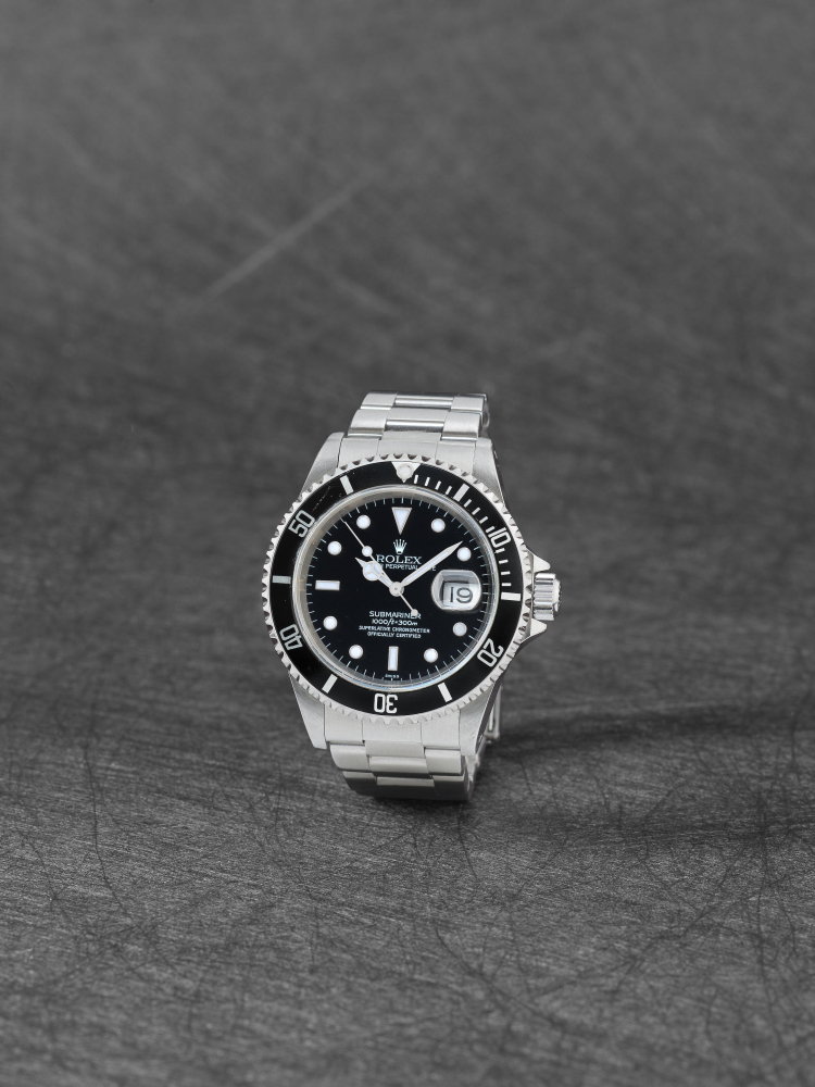 Rolex. A stainless steel automatic calendar bracelet watch