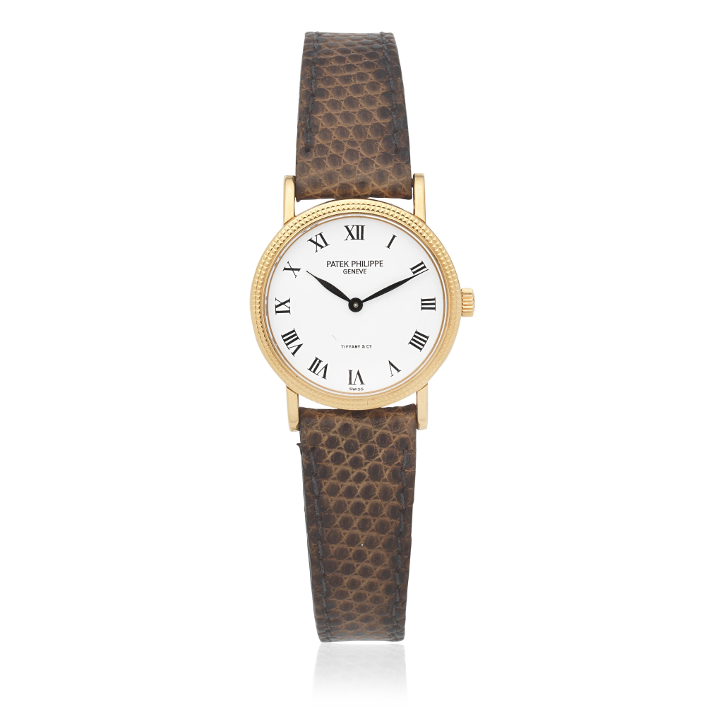 Patek Philippe. A lady's 18K gold manual wind wristwatch Retailed by Tiffany & Co