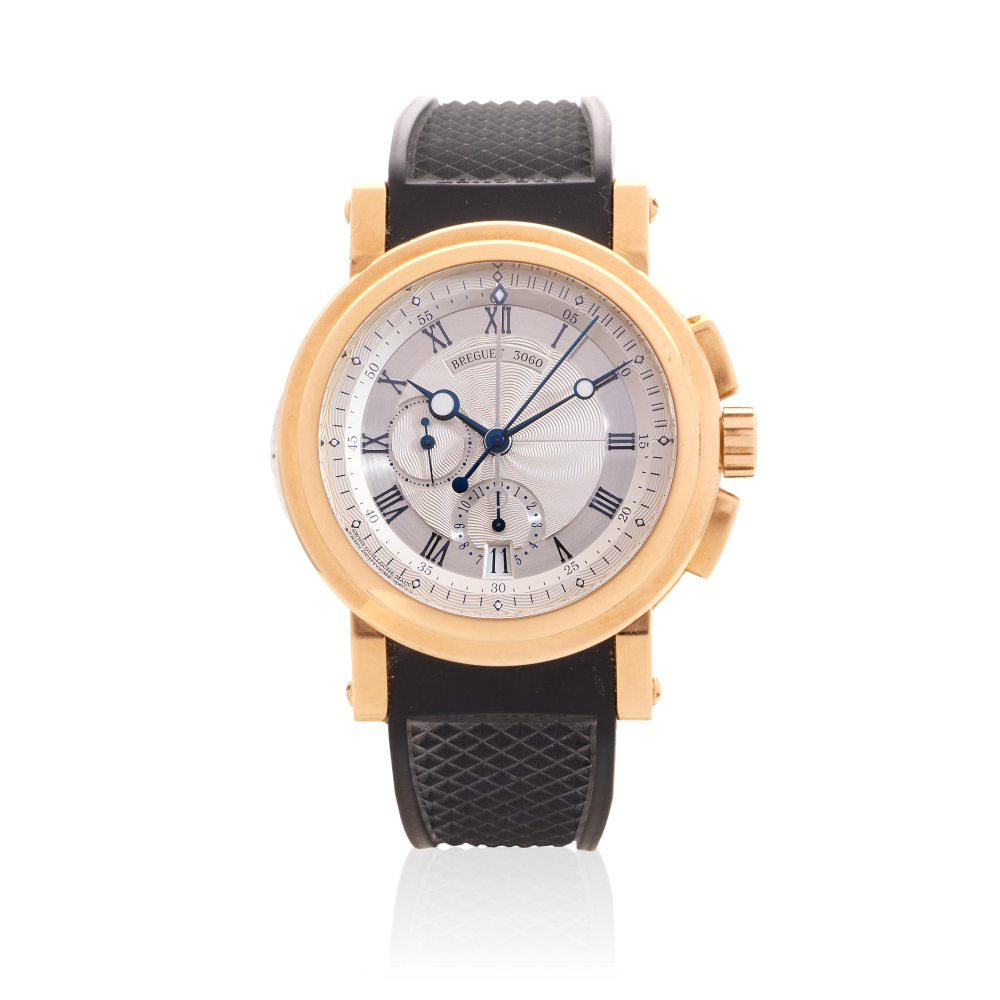 Breguet. An 18K gold automatic calendar flyback chronograph wristwatch