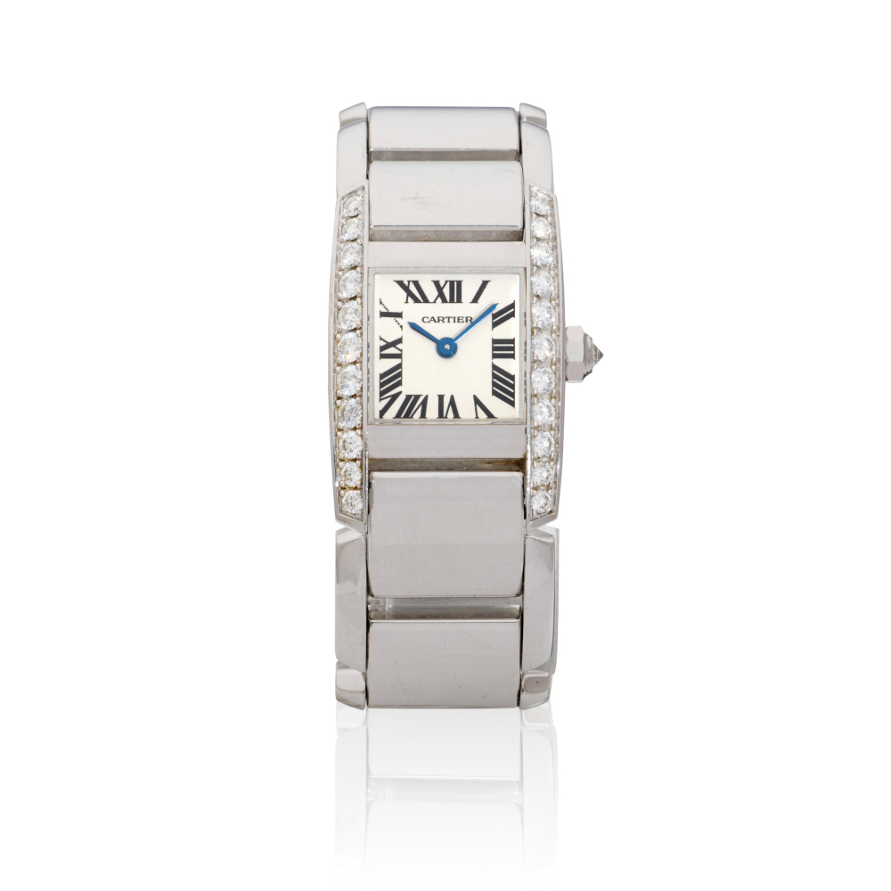 Cartier. A lady's 18K white gold diamond set quartz bracelet watch