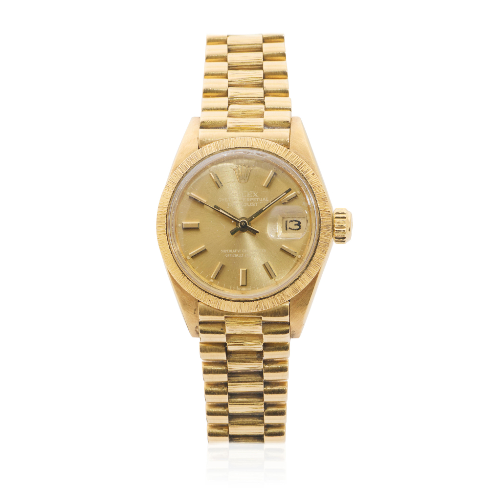 Rolex. A lady's 18K gold automatic calendar bracelet watch