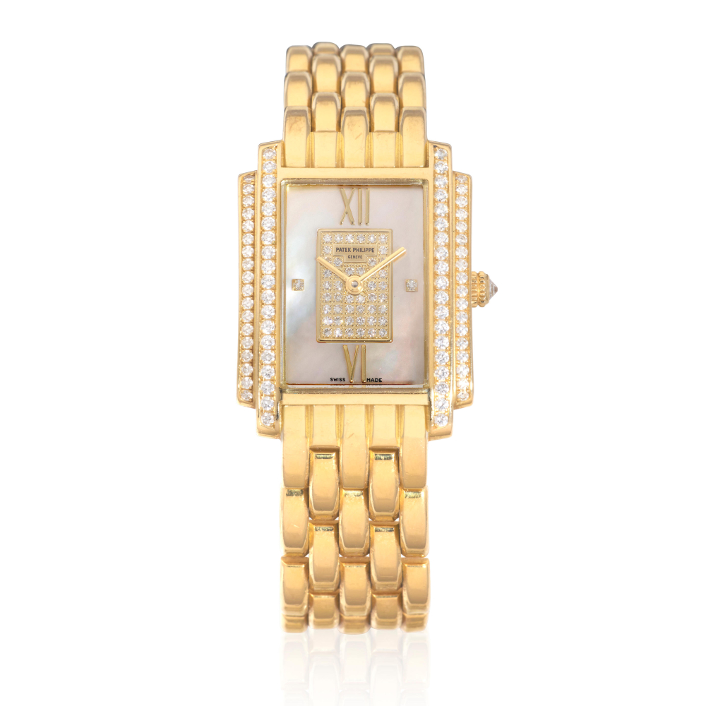 Patek Phillippe. A lady's 18K gold diamond set quartz bracelet watch with mother of pearl dial