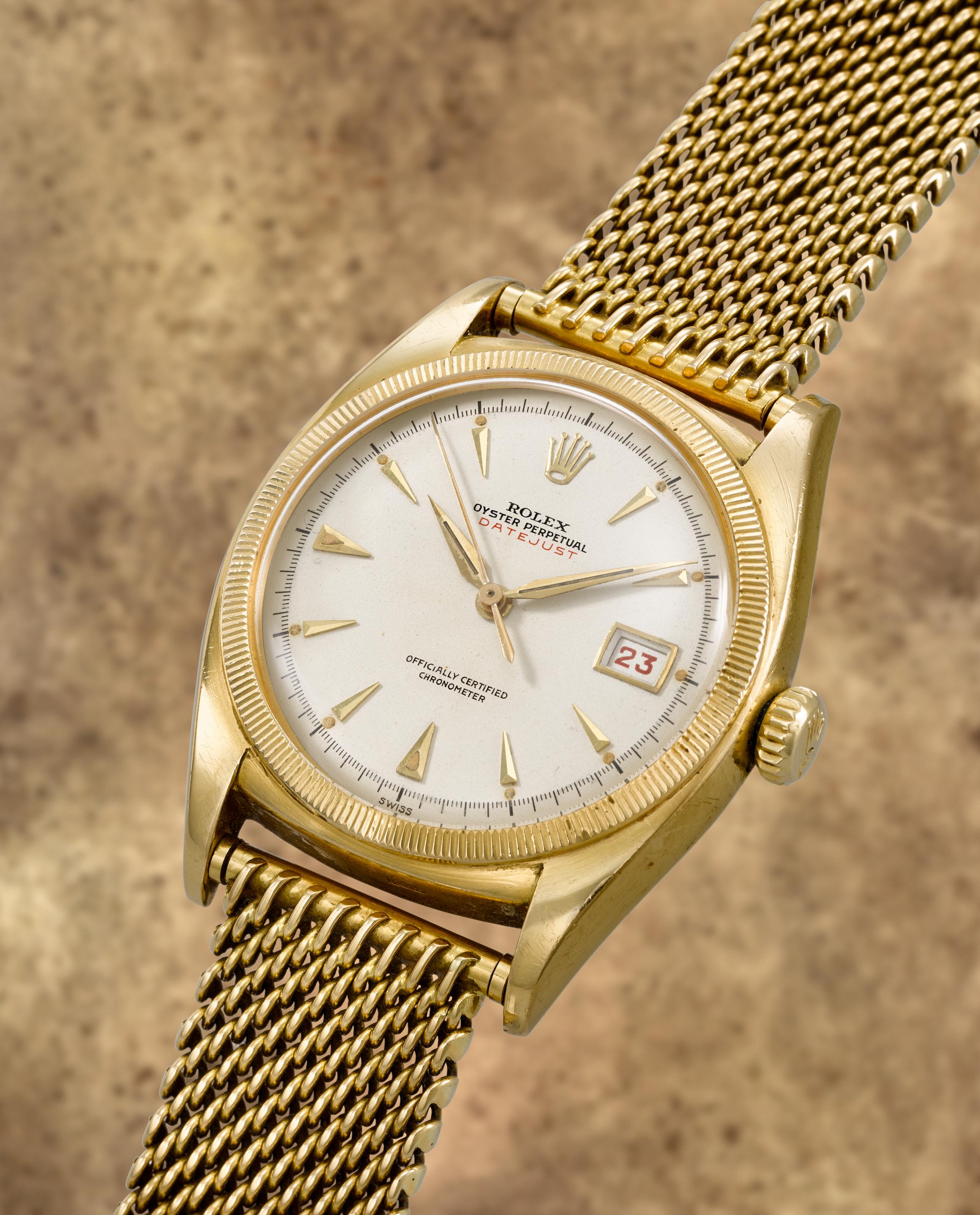 Rolex. A fine and rare 18K gold automatic calendar bracelet watch