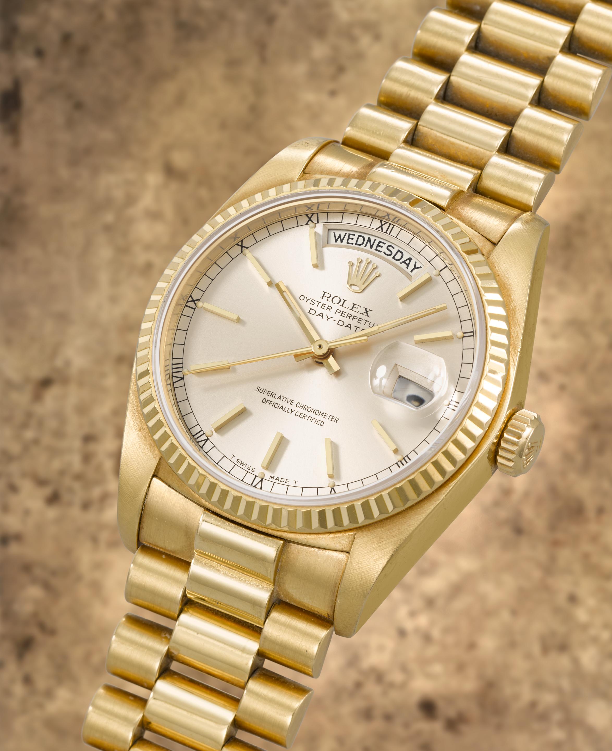 Rolex. A fine 18K gold automatic calendar bracelet watch