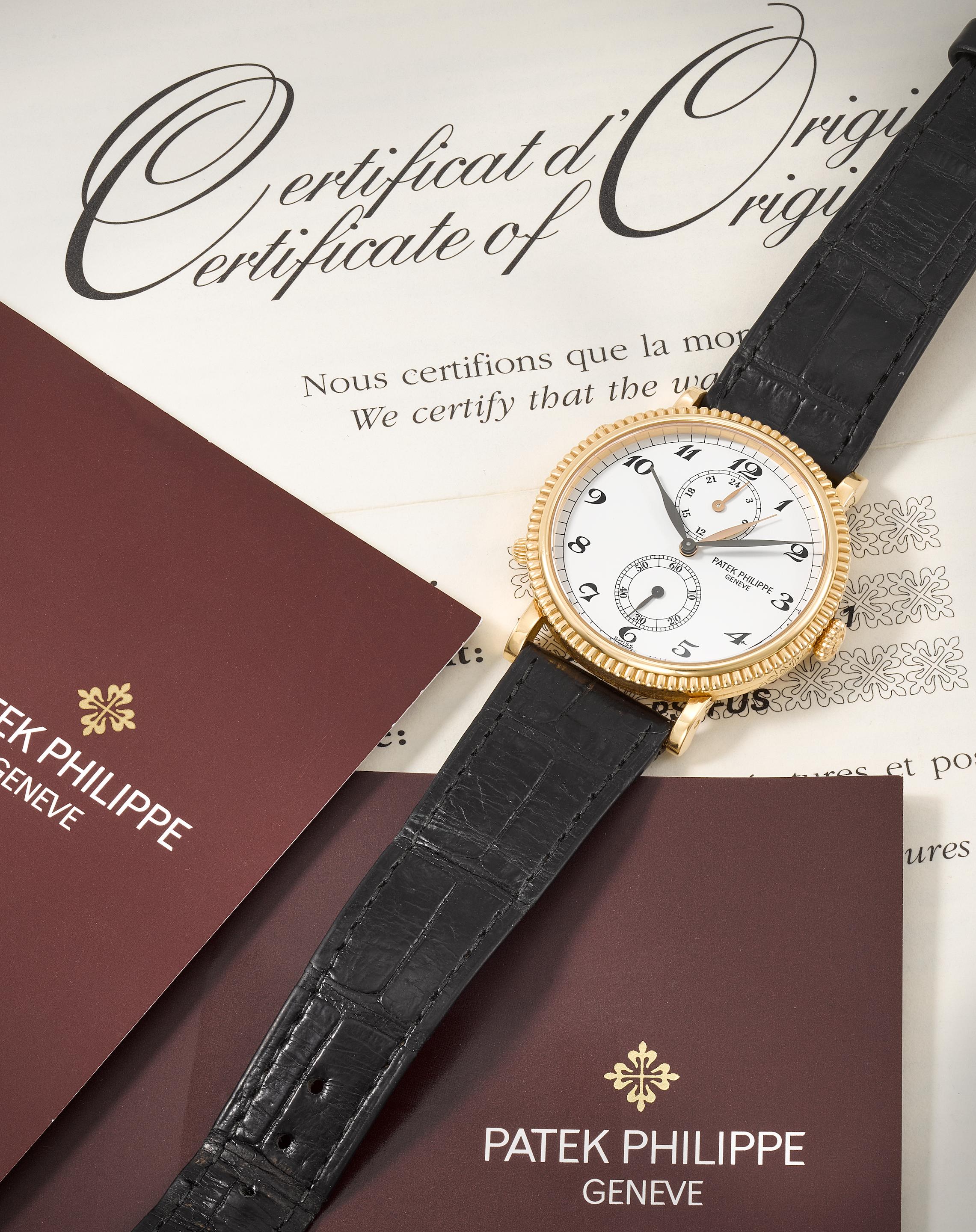 Patek Philippe. An 18K rose gold manual wind wristwatch with dual time zone