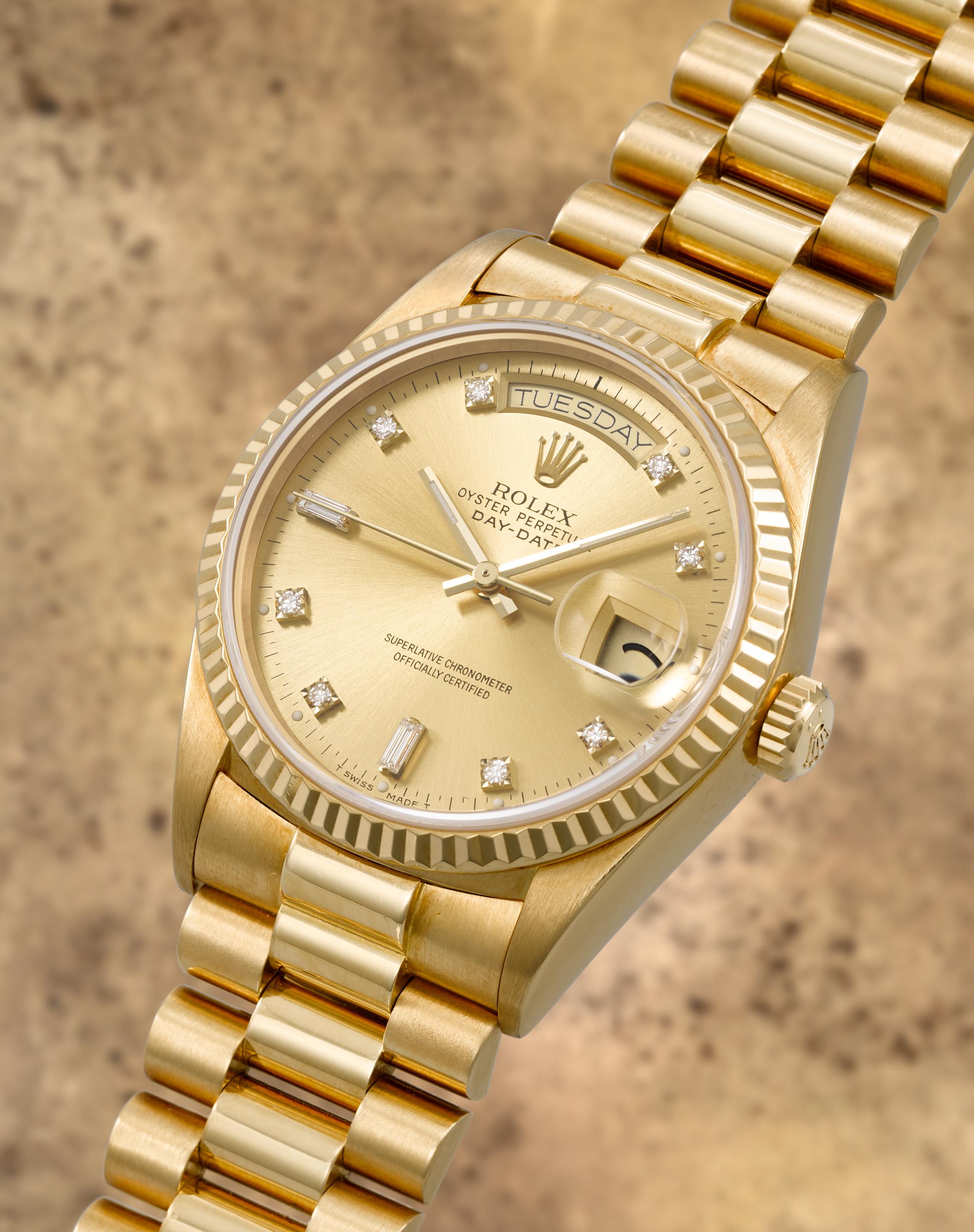 Rolex. A fine 18K gold diamond set automatic calendar bracelet watch