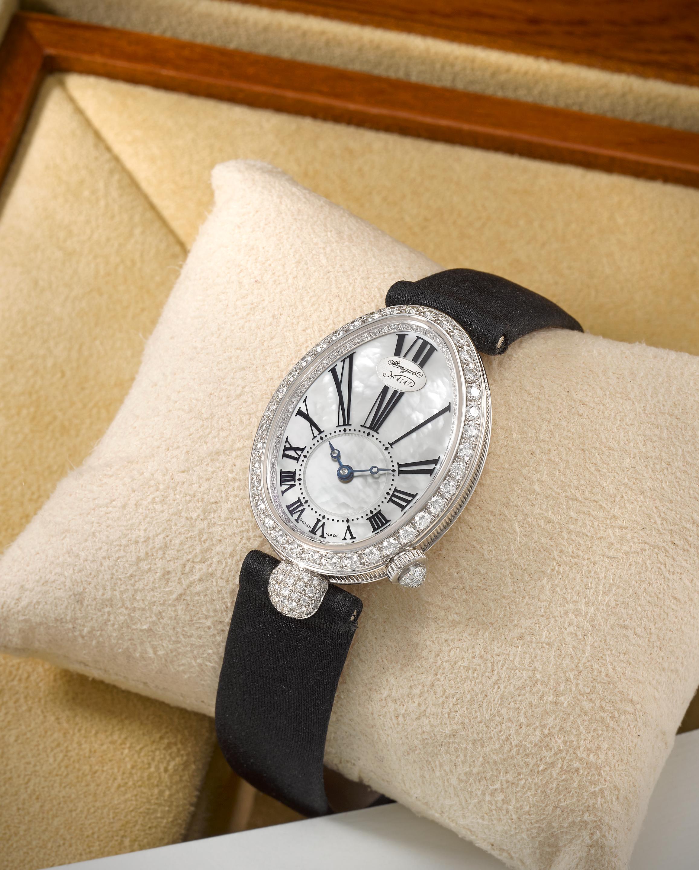 Breguet. A fine lady's 18K white gold diamond set wristwatch with mother of pearl dial