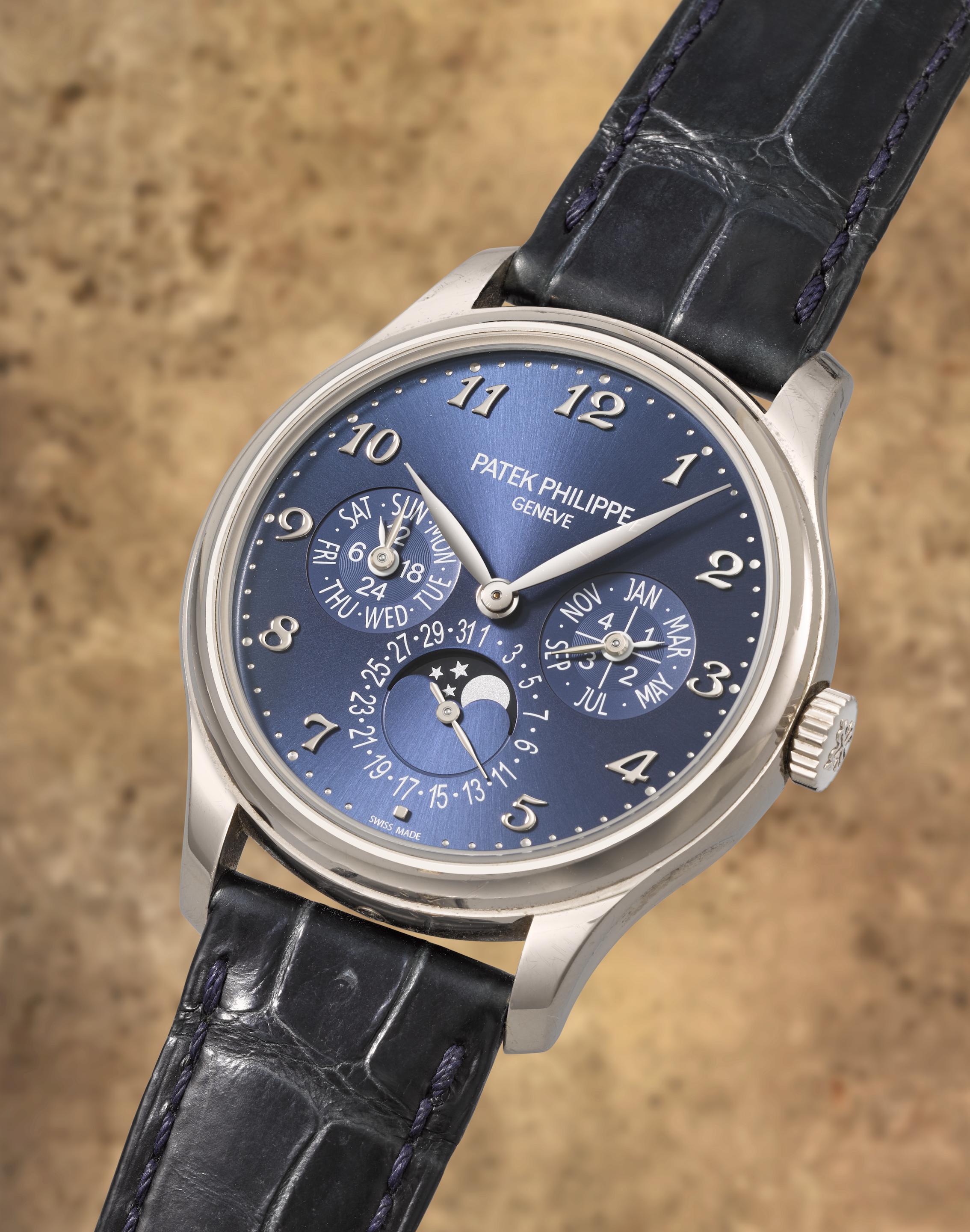 Patek Philippe. A fine and rare 18K white gold automatic perpetual calendar wristwatch with moon phase