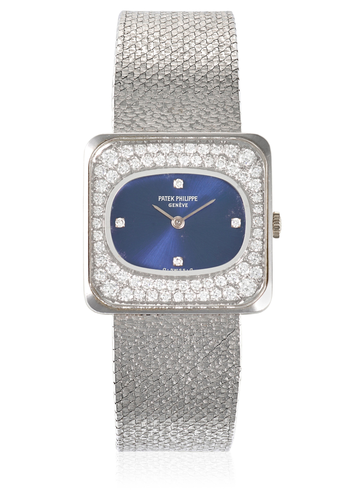 PATEK PHILIPPE. AN 18K WHITE GOLD AND DIAMOND SET MANUAL WIND BRACELET WATCH