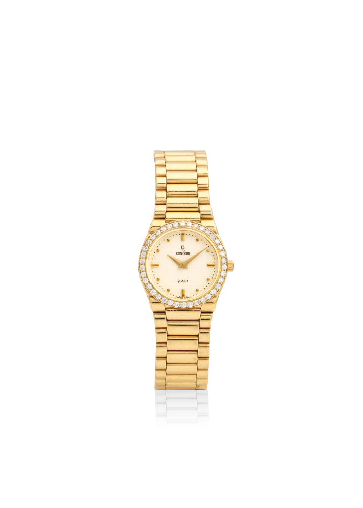 CONCORD. AN 18K GOLD QUARTZ BRACELET WATCH