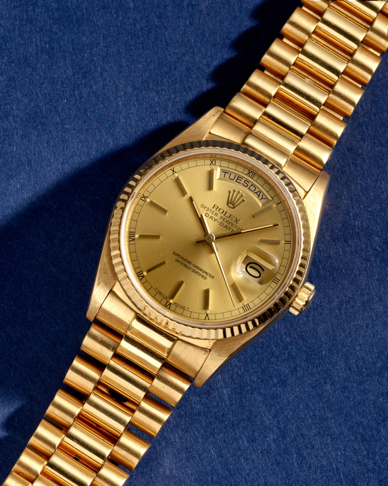 ROLEX. AN 18K GOLD AUTOMATIC CALENDAR BRACELET WATCH