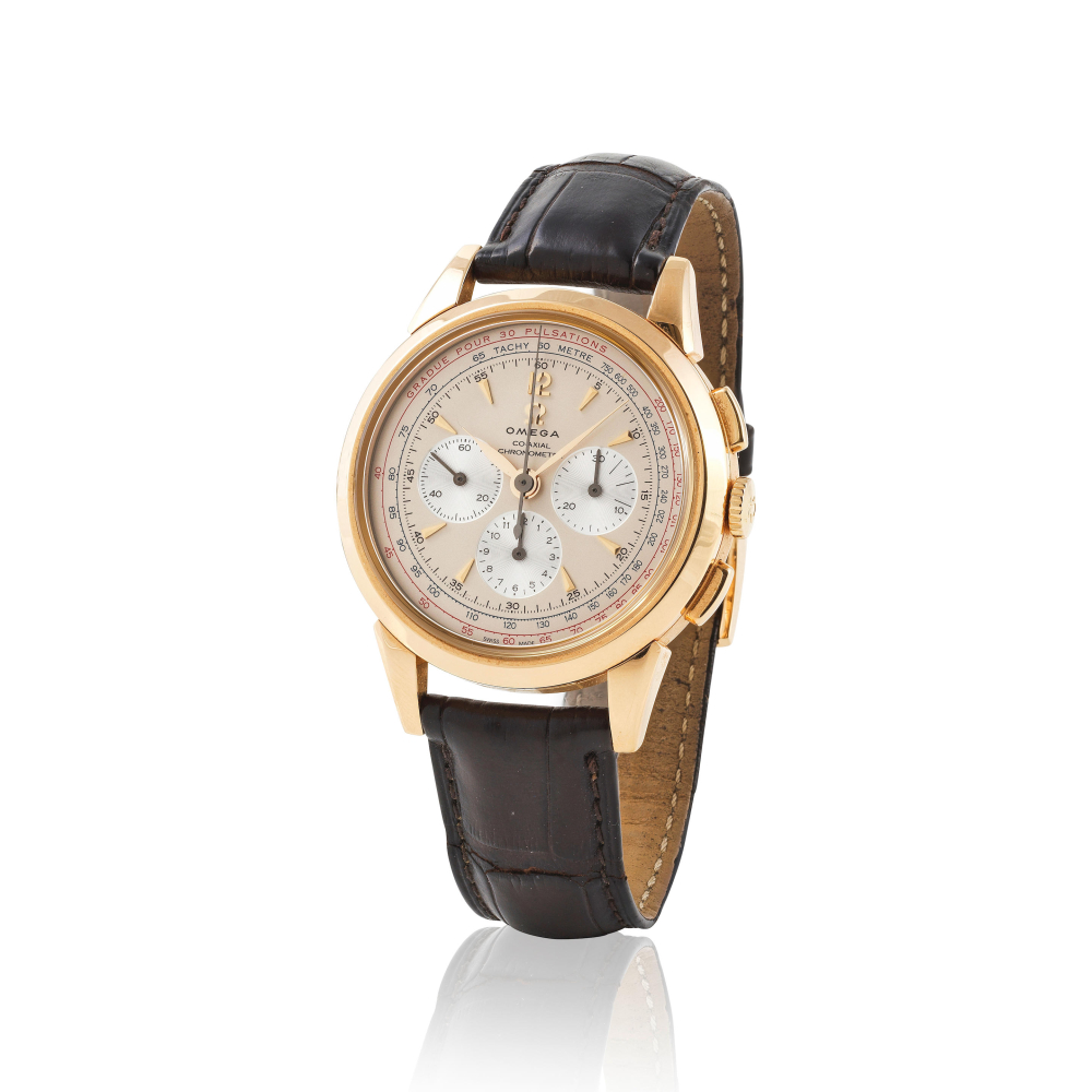 Omega. An 18K gold manual wind chronograph wristwatch
