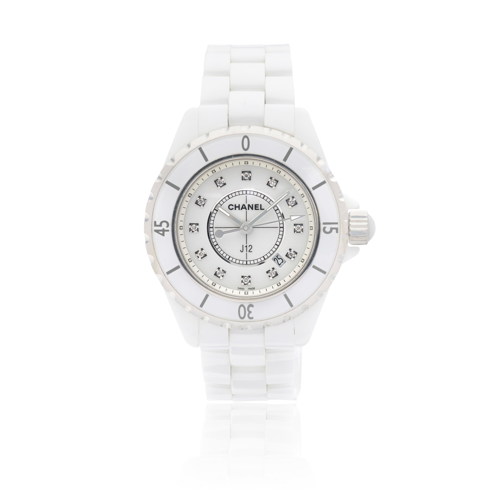 Chanel. A recently serviced white ceramic and stainless steel diamond set quartz calendar bracelet watch