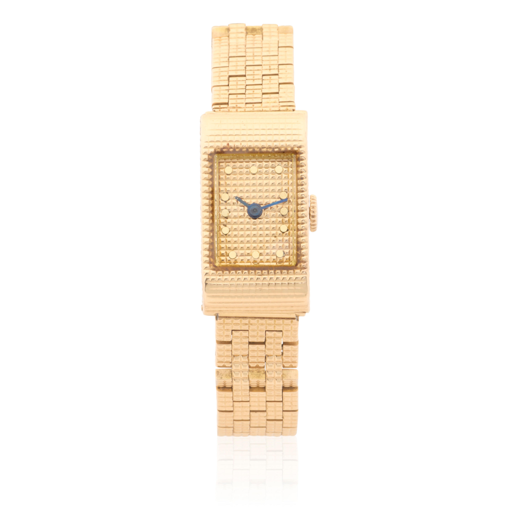 Boucheron. A lady's 18K gold manual wind bracelet watch
