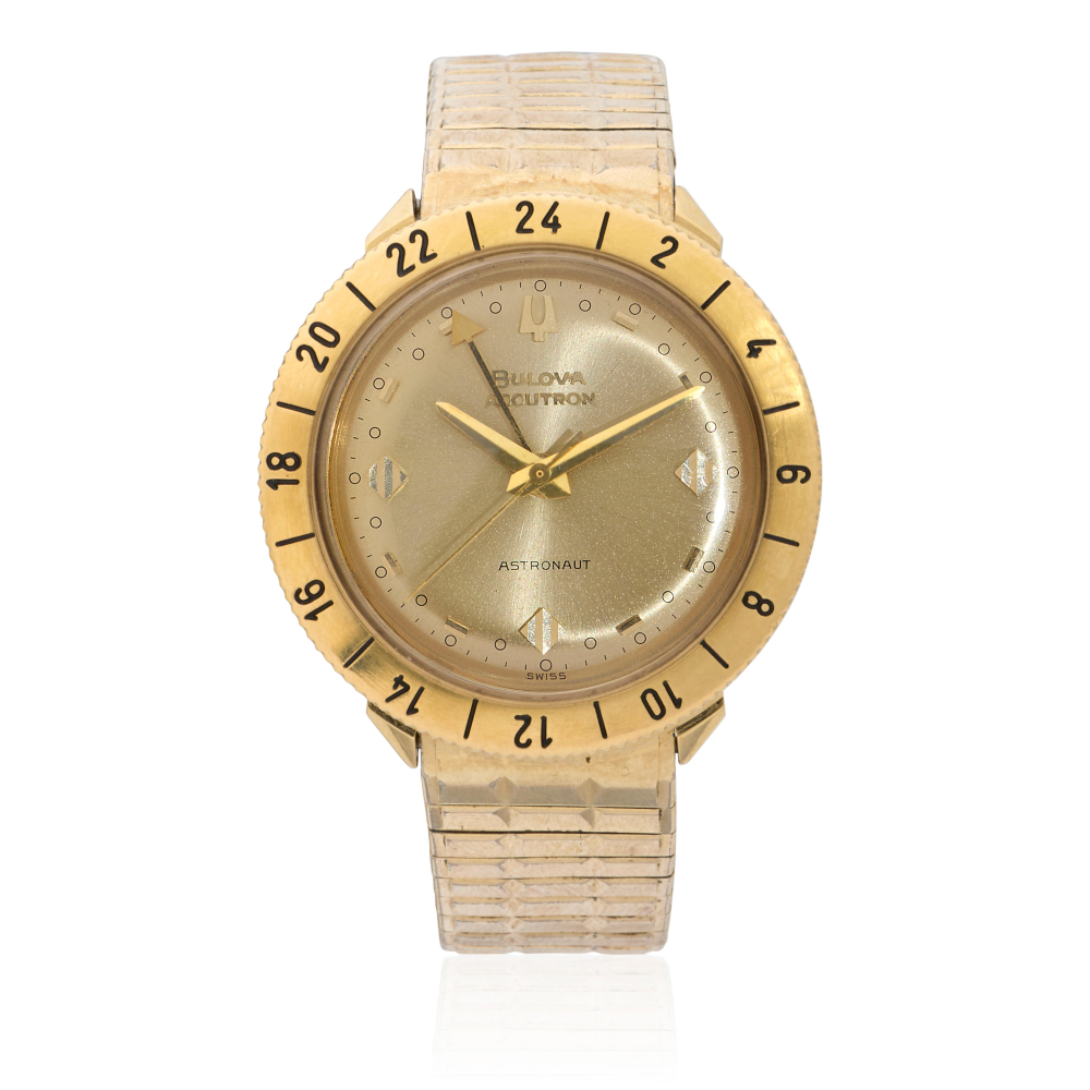 Bulova. An 18K gold electronic bracelet watch