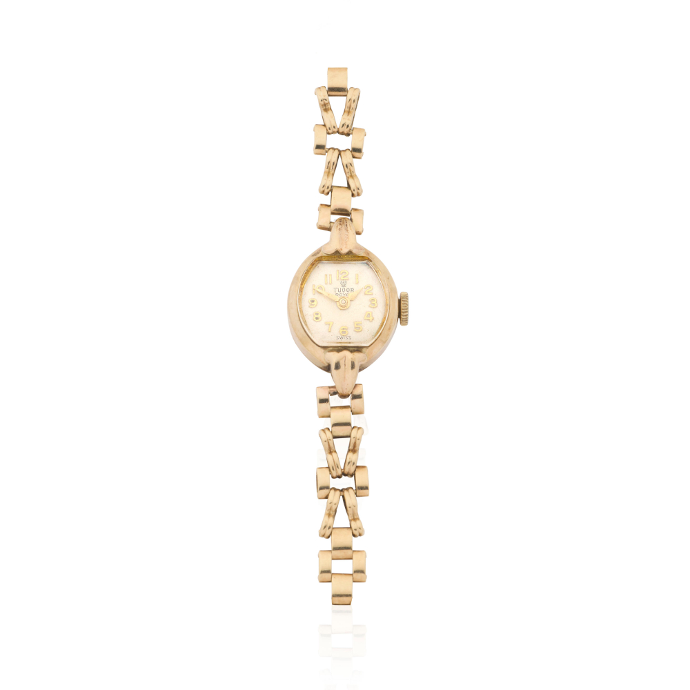 Tudor. A lady's 9K gold manual wind bracelet watch