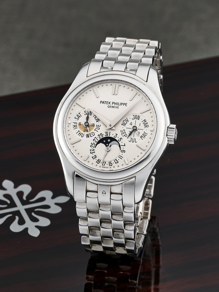 PATEK PHILIPPE | GRAND COMPLICATIONS, REF.5136/1G, A WHITE GOLD PERPETUAL CALENDAR BRACELET WATCH WITH MOON PHASES, CIRCA 2005