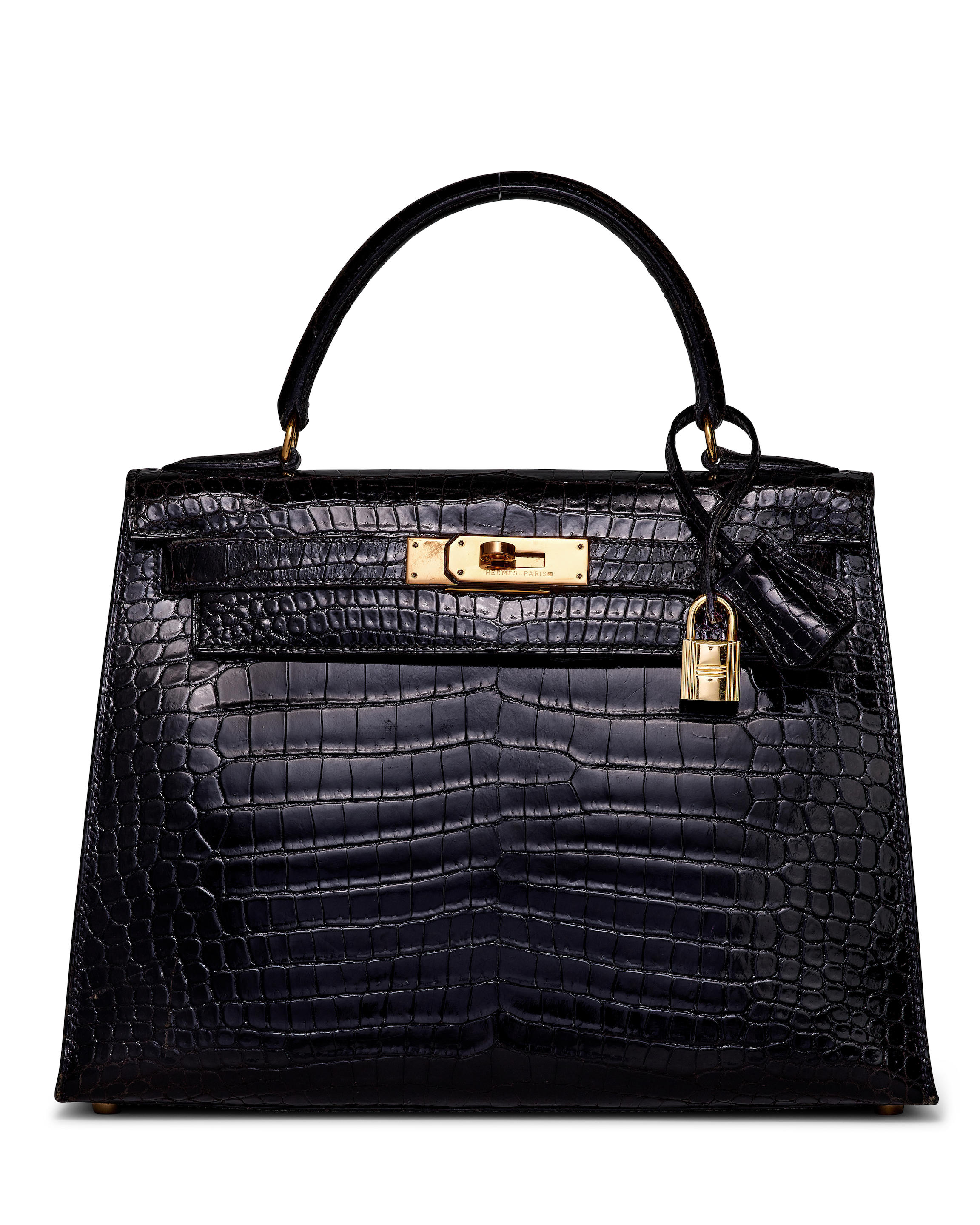 HERMÈS: BLACK POROSUS SELLIER KELLY 28 WITH GOLD HARDWARE 1992