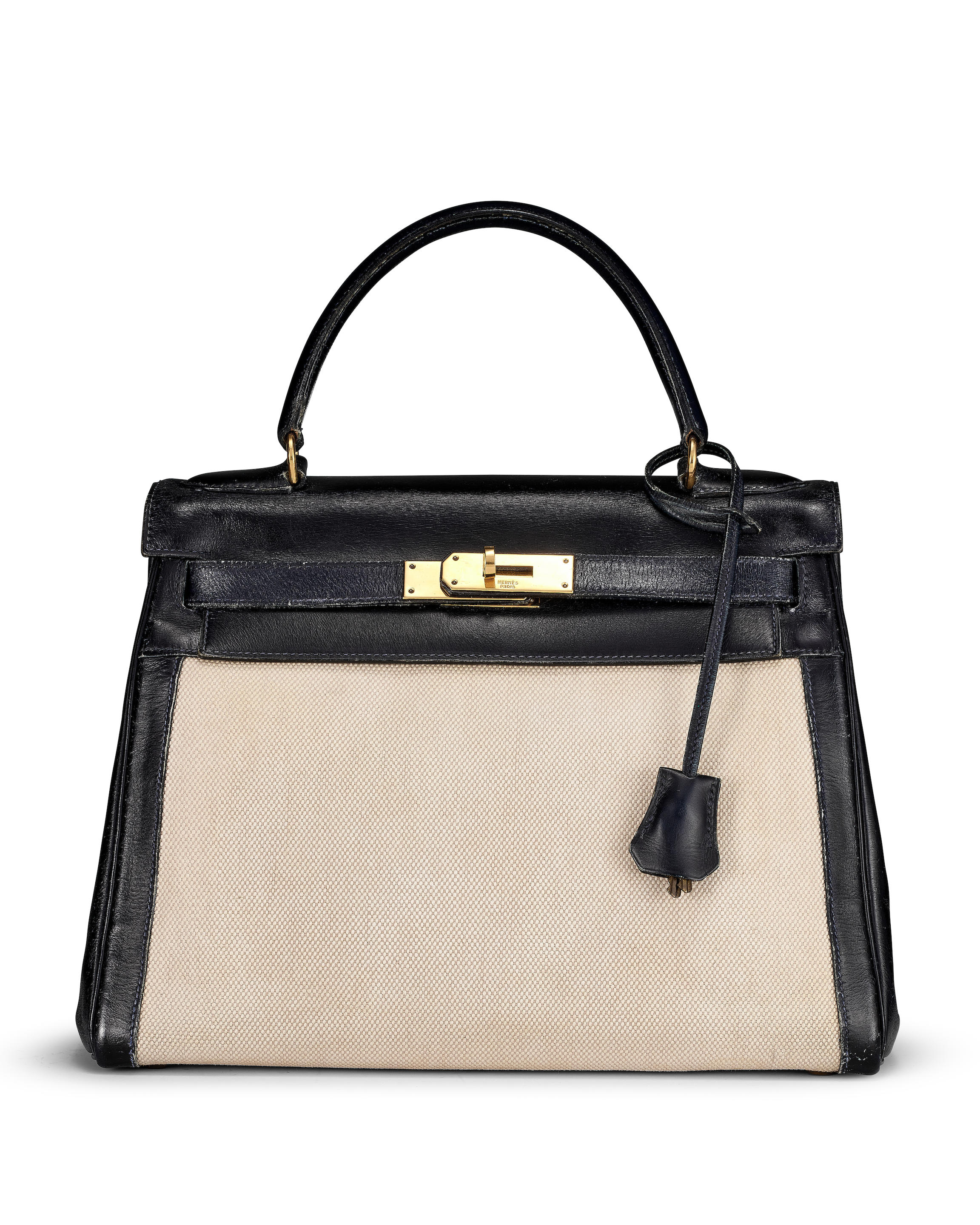 HERMÈS: NOIR BOX AND TOILE KELLY 28 WITH GOLD HARDWARE 1975