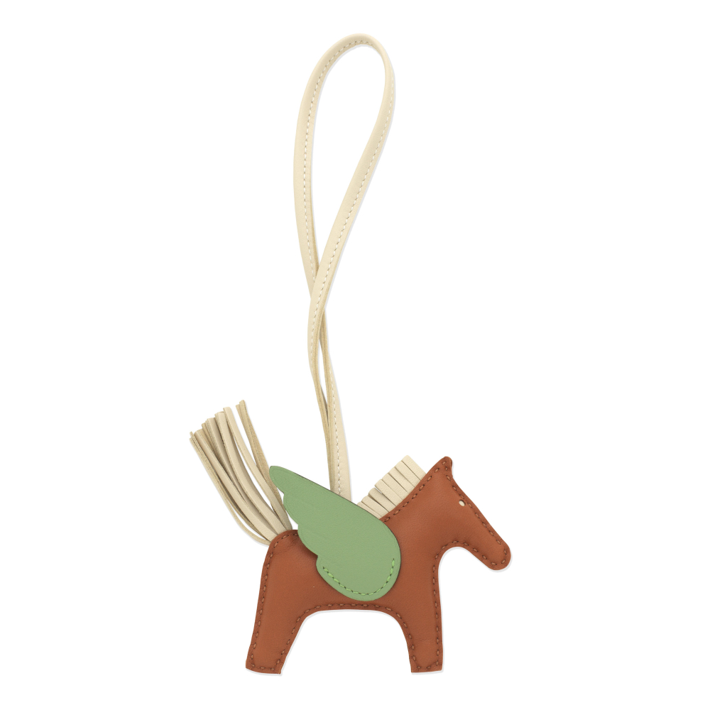 Hermès: a Gold, Craie and Vert Criquet Rodeo Pegase PM Charm
