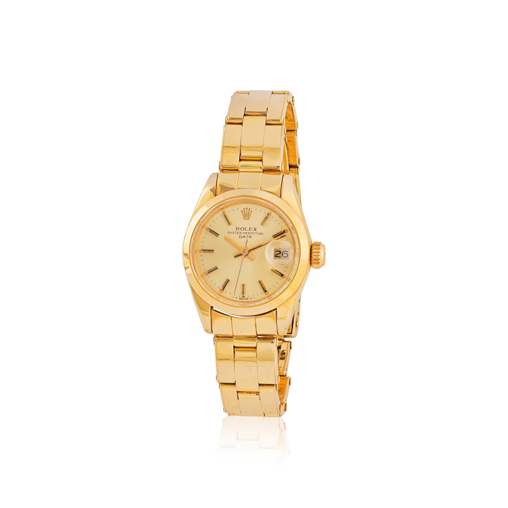 Rolex. A fine lady's 18K gold automatic calendar bracelet watch