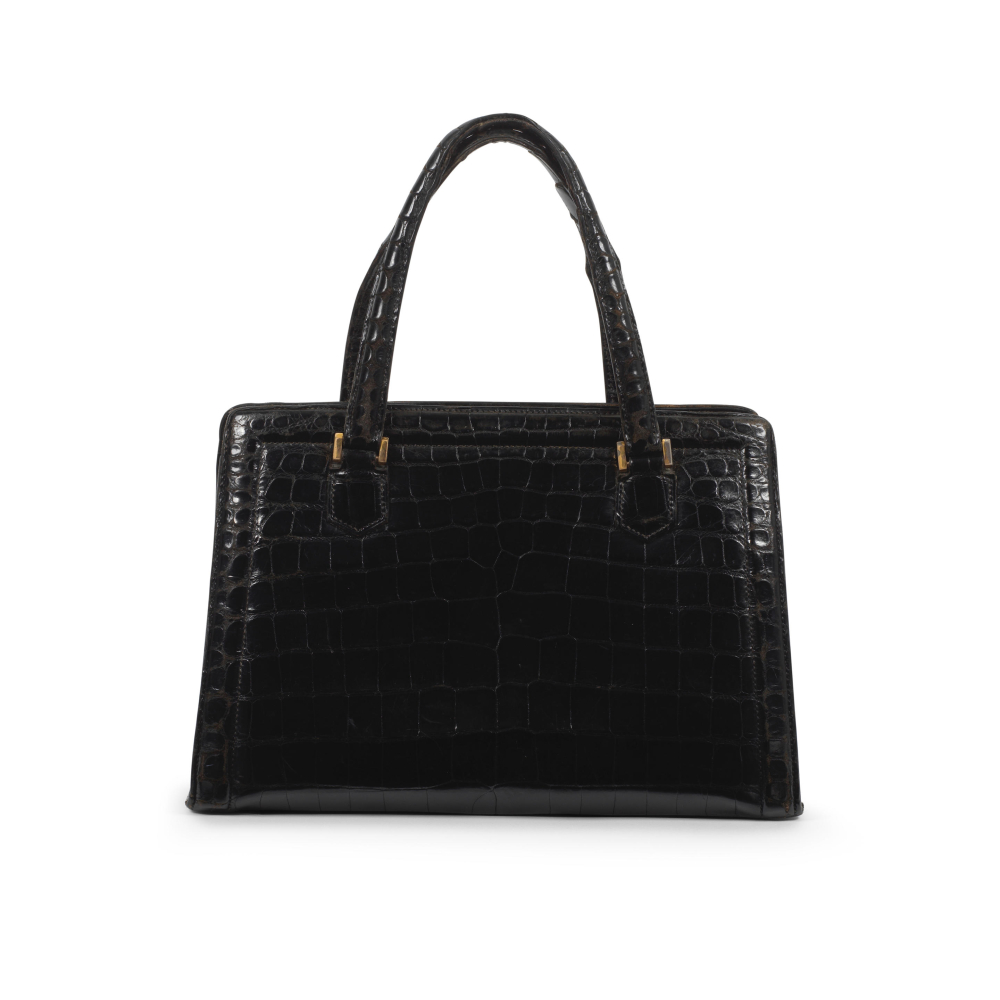 Hermès: a Shiny Black Crocodile Pullman Top Handle Bag