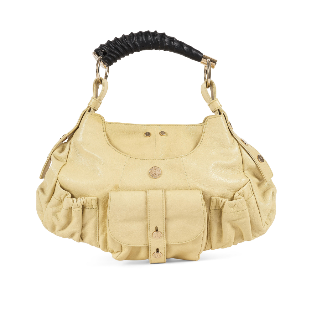 Yves Saint Laurent. Sac Mombassa PM en cuir grainé pistache.