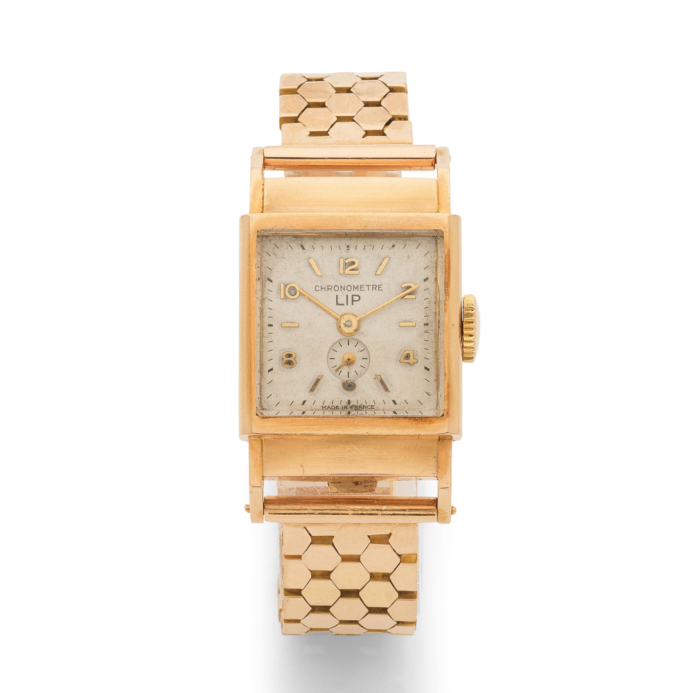 Lip. An 18K gold manual wind bracelet watch