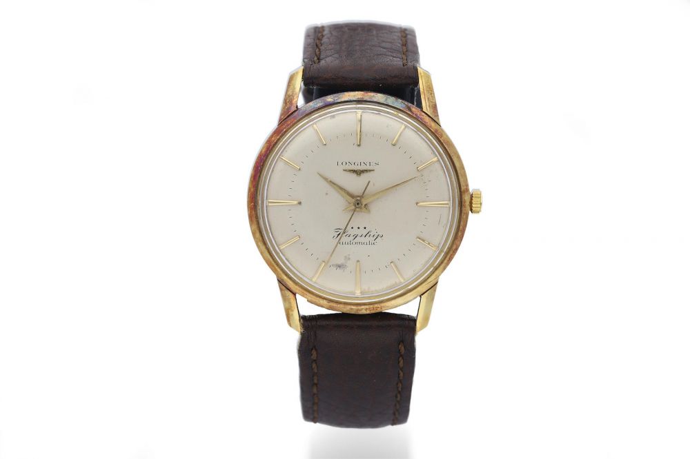 Longines. An 14K Yellow Gold Automatic Wristwatch