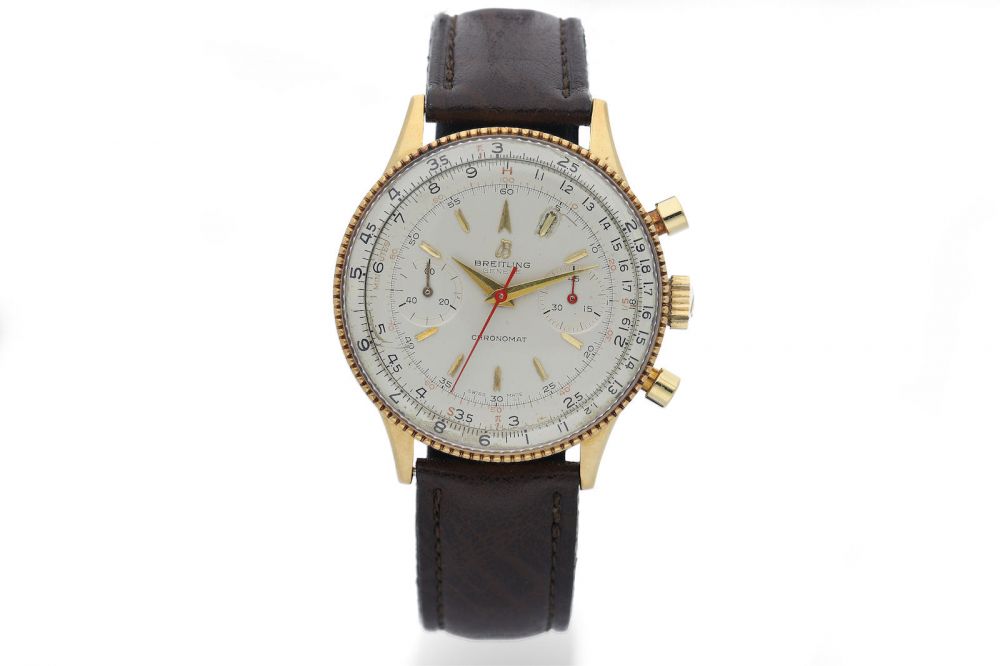 Breitling. A Yellow Gold Chronograph Wristwatch with Bi-Directional Inner Rule Scale