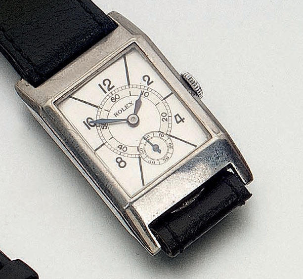 Rolex. A stainless steel rectangular wristwatch